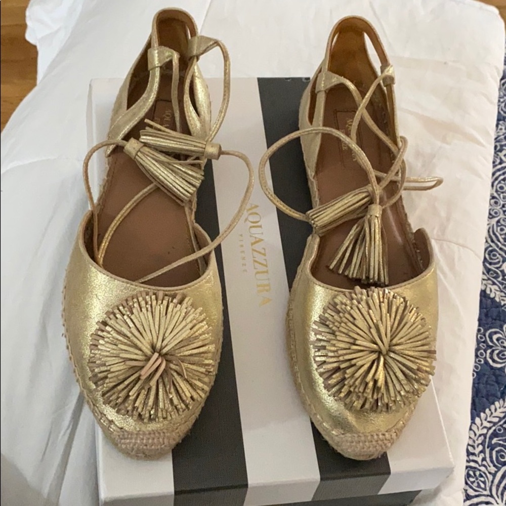 Gold flat with tie around ankle